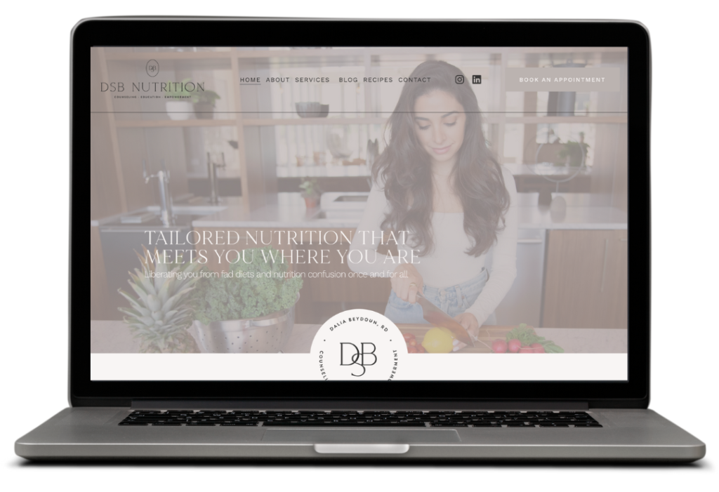Laptop featuring a website with image of a woman chopping vegetables
