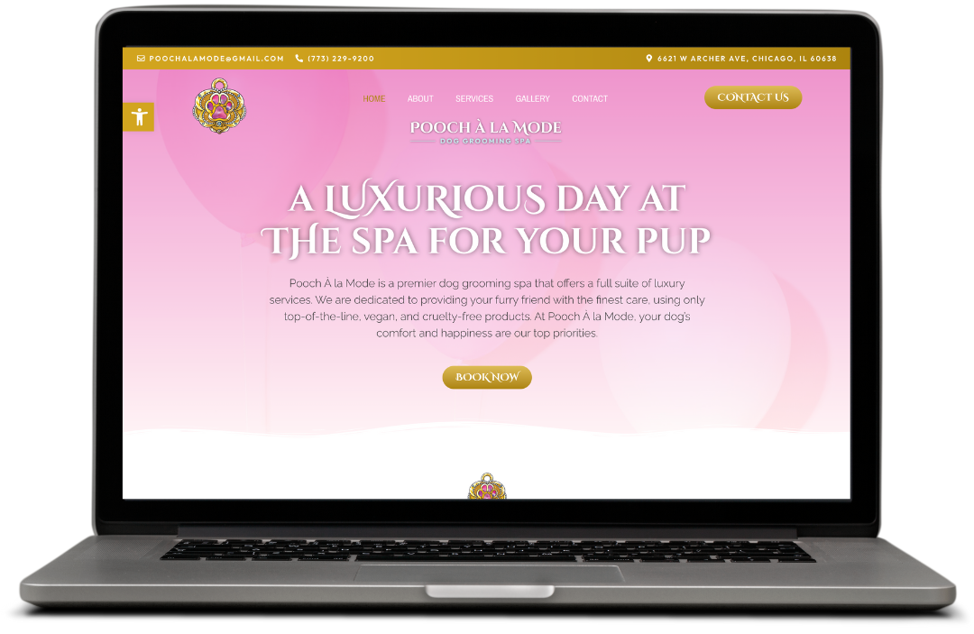 Pink website for a dog groomer on a laptop