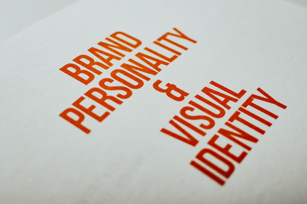 Close-up of 'Brand Personality & Visual Identity' text in red on white paper.